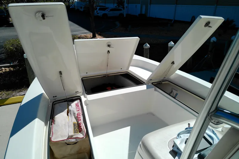 Slide: The Image of 2016 Pathfinder 2200 T boat with open storage compartments and safety gear bag. - 20