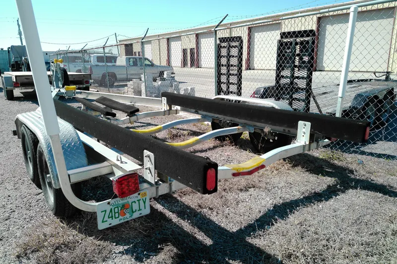 Slide: The Image of 2016 Pathfinder 2200 T boat trailer parked in a fenced lot. - 26