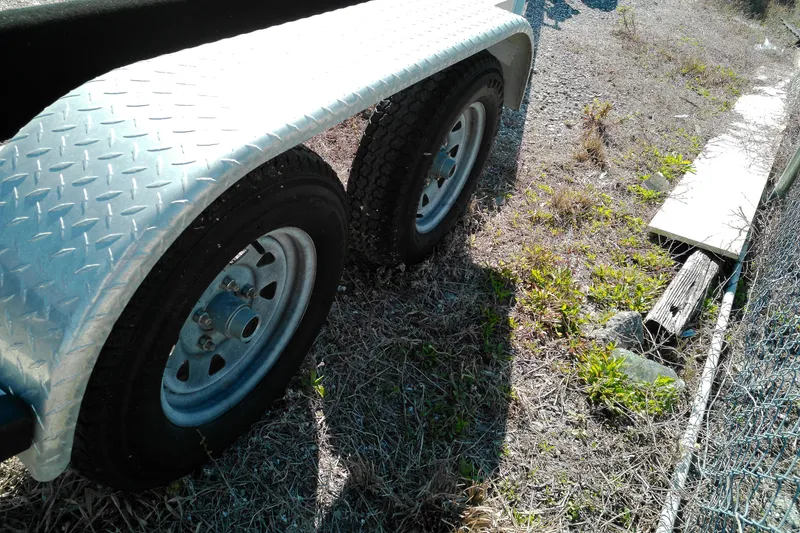 Slide: The Image of Trailer wheels on gravel, 2016 Pathfinder 2200 T, with diamond plate fender. - 28
