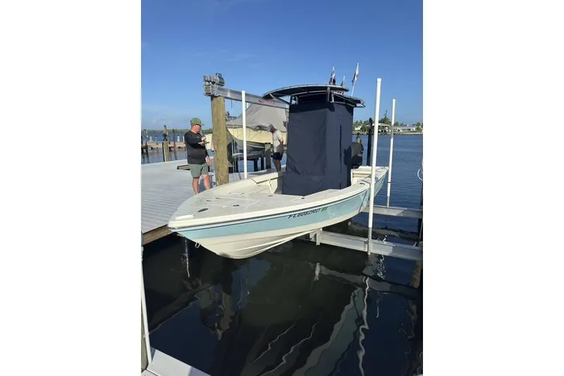 Slide: The Image of 2016 Pathfinder 2200 T boat docked at marina with clear blue sky. - 33