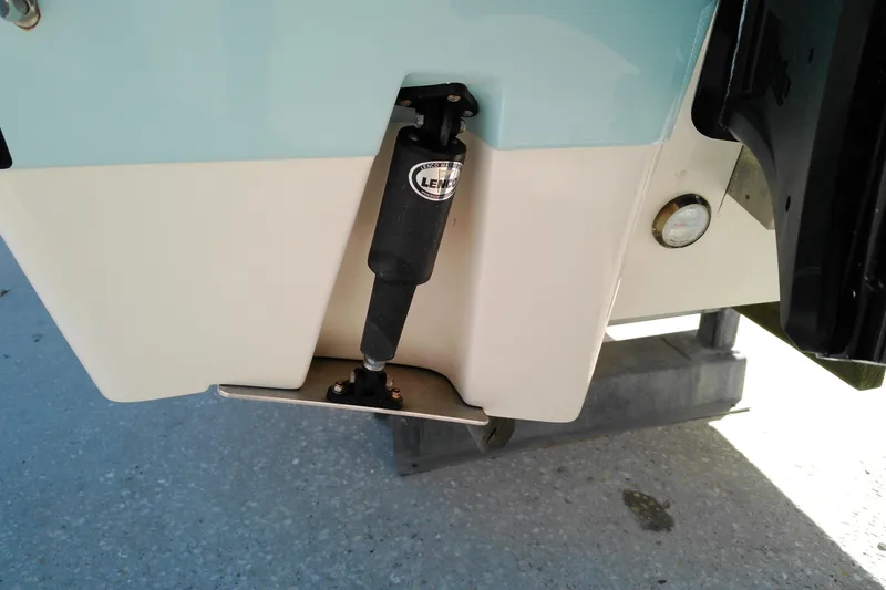 Slide: The Image of 2016 Pathfinder 2200 T boat trim tab detail with Lenco actuator. - 7