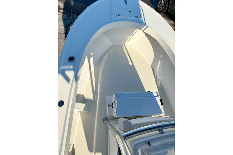 Slide: The Image of 2015 Parker 21SE Center Console boat interior, featuring spacious deck and seating area. - 10