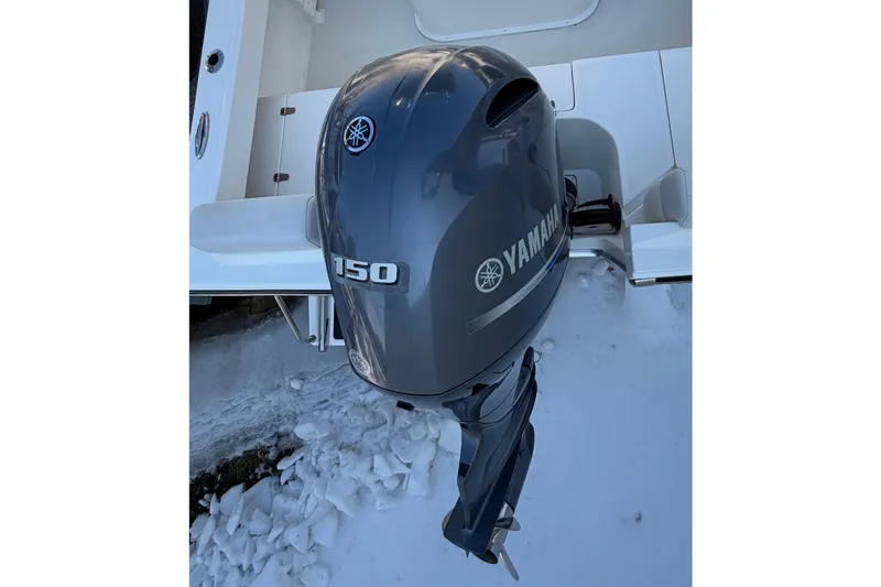 Slide: The Image of Yamaha 150 outboard motor on 2015 Parker 21SE Center Console boat in snowy setting. - 13