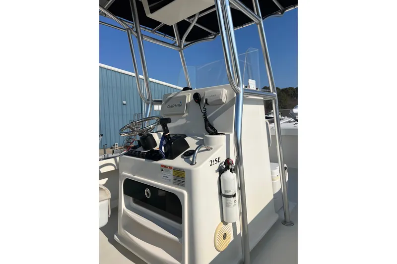 Slide: The Image of 2015 Parker 21SE Center Console boat with Garmin navigation system and safety equipment. - 9