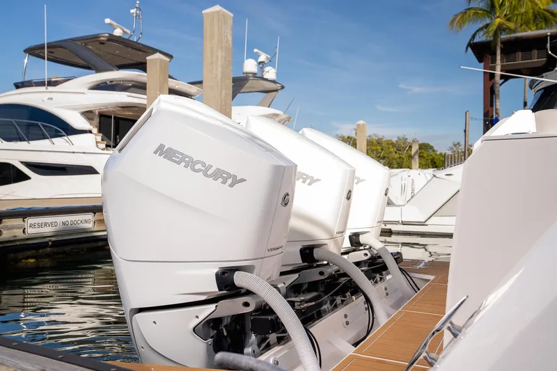 Slide: The Image of 2025 Regal 38 SAV with Mercury outboard engines docked at marina. - 3