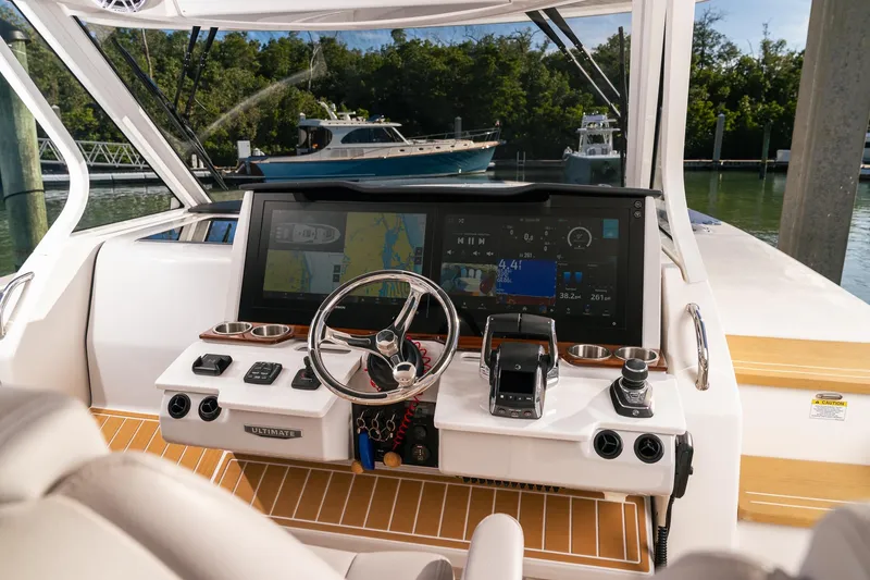 Slide: The Image of 2025 Regal 38 SAV boat dashboard with advanced navigation and control systems. - 4