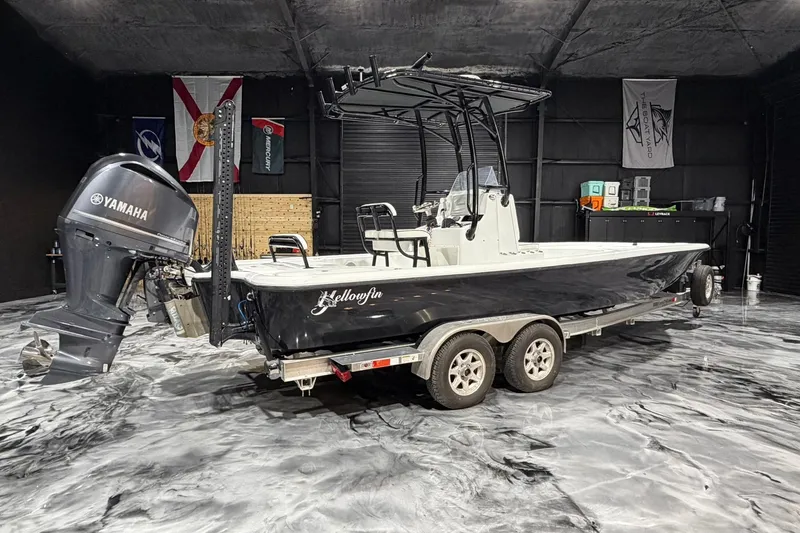 The Image of 2011 Yellowfin 24 Bay boat with Yamaha engine on trailer in garage. - 0