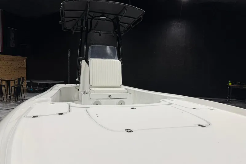 Slide: The Image of 2011 Yellowfin 24 Bay boat with T-top in indoor setting. - 14