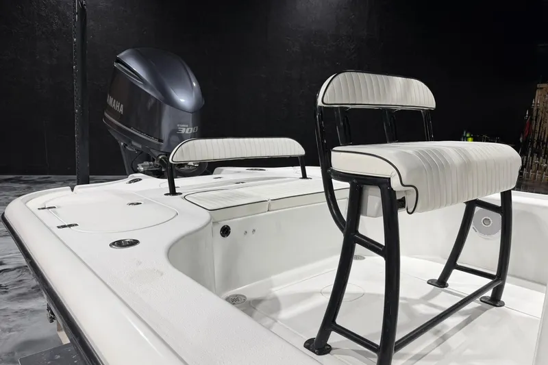 Slide: The Image of 2011 Yellowfin 24 Bay boat with Yamaha 300 engine, featuring white seating and sleek design. - 16