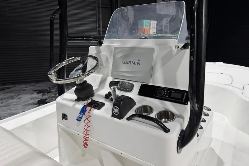 Slide: The Image of 2011 Yellowfin 24 Bay boat console with Garmin navigation system and steering wheel. - 17