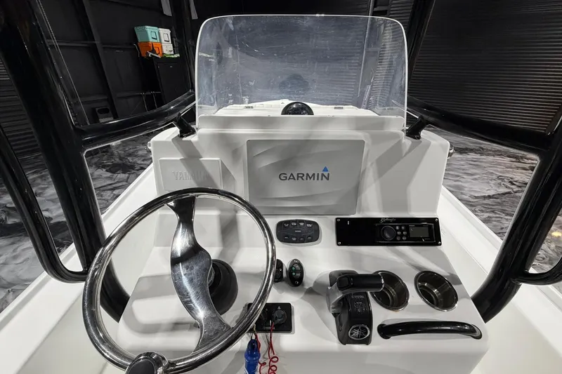 Slide: The Image of 2011 Yellowfin 24 Bay boat console with Garmin navigation system and Yamaha controls. - 18