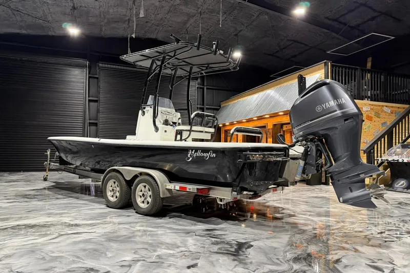 Slide: The Image of 2011 Yellowfin 24 Bay boat with Yamaha engine in a showroom setting. - 7