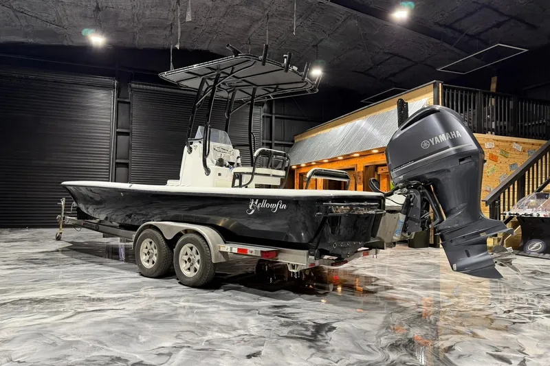 Slide: The Image of 2011 Yellowfin 24 Bay boat with Yamaha engine on trailer in showroom. - 8