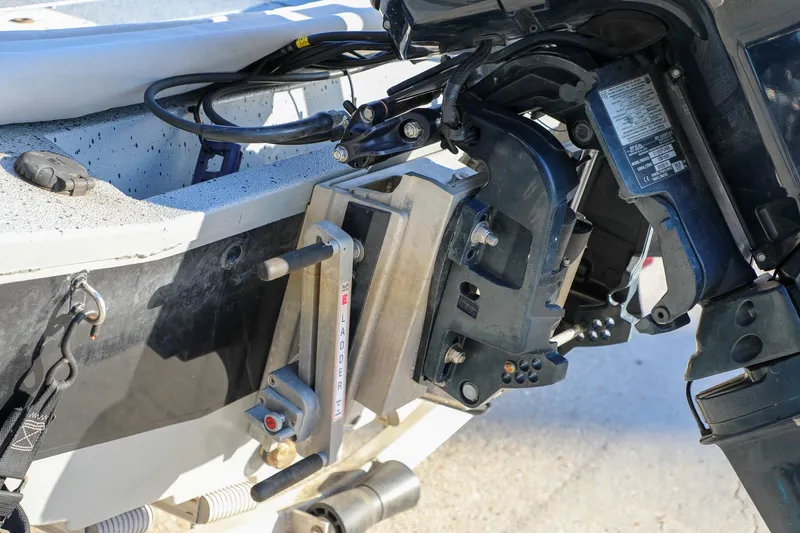Slide: The Image of Close-up of a 2019 Express 18 boat motor mount and ladder mechanism. - 13