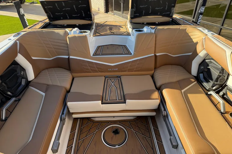 Slide: The Image of Luxurious interior of 2024 Tigé Ultré 23ZX boat with tan leather seating. - 21