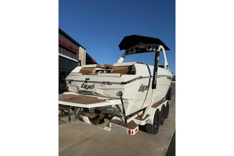 Slide: The Image of 2024 Tigé Ultré 23ZX boat on trailer, rear view, sunny day. - 24