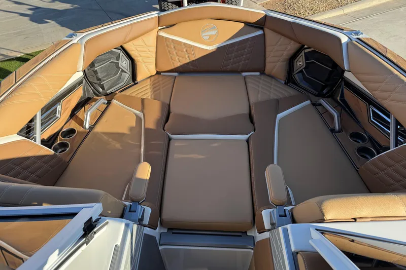 Slide: The Image of Luxurious interior of 2024 Tigé Ultré 23ZX boat with tan leather seating. - 8