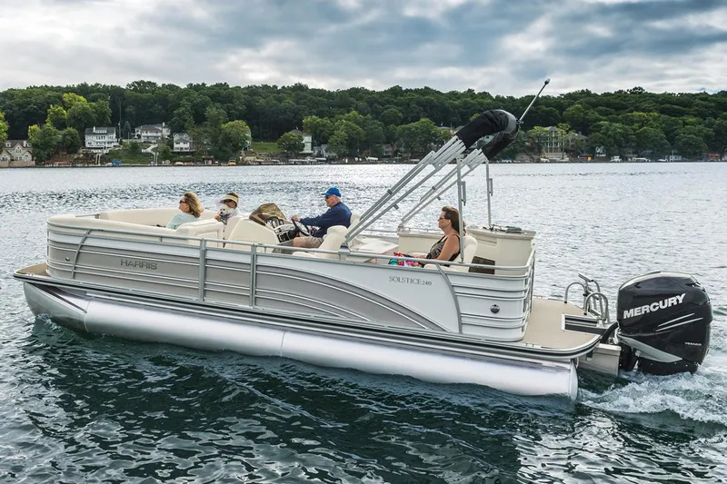 The Image of Manufacturer Provided Image: 2015 Harris Solstice 240 pontoon boat cruising on a lake with passengers. - 0
