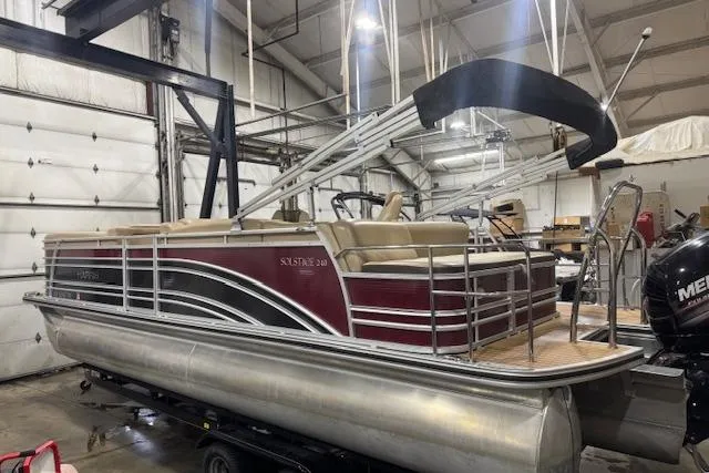 Slide: The Image of 2015 Harris Solstice 240 pontoon boat in a warehouse setting. - 5