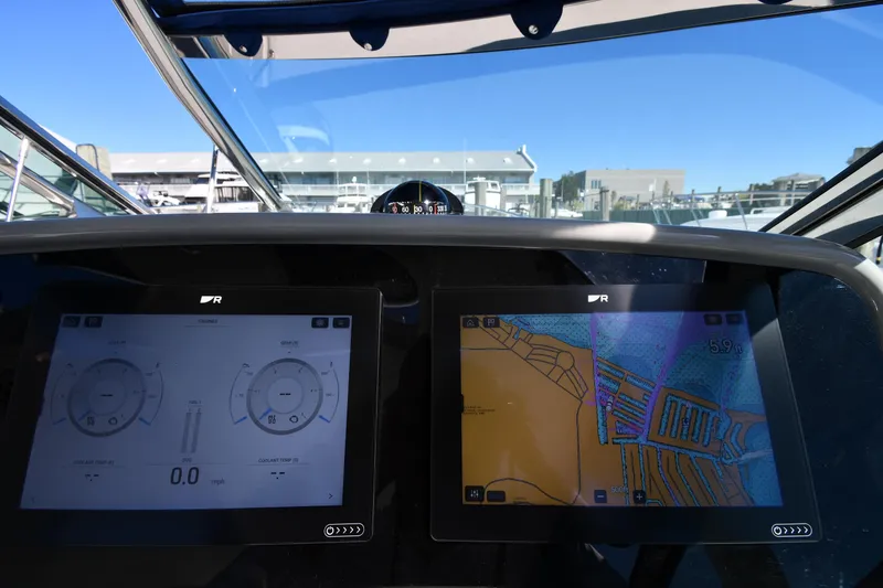 Slide: The Image of 2008 Formula 400 Super Sport dashboard with navigation screens. - 14