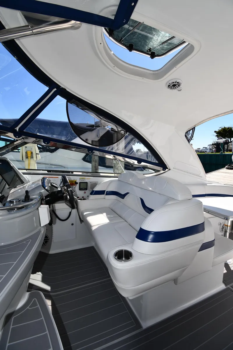 Slide: The Image of 2008 Formula 400 Super Sport boat interior with white seating. - 19