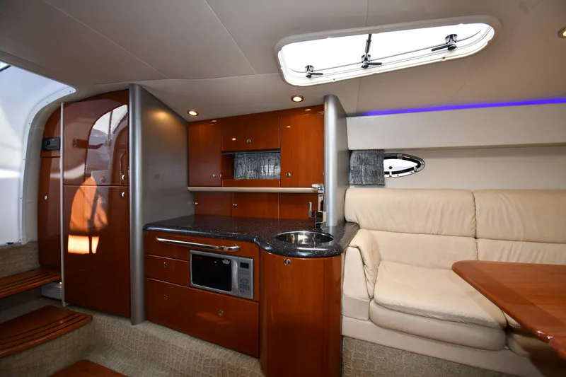Slide: The Image of 2008 Formula 400 Super Sport yacht interior with kitchen and seating. - 44