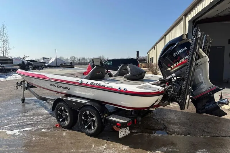 Slide: The Image of 2021 Falcon Boats F205 on trailer with Yamaha outboard motor, parked outdoors. - 5