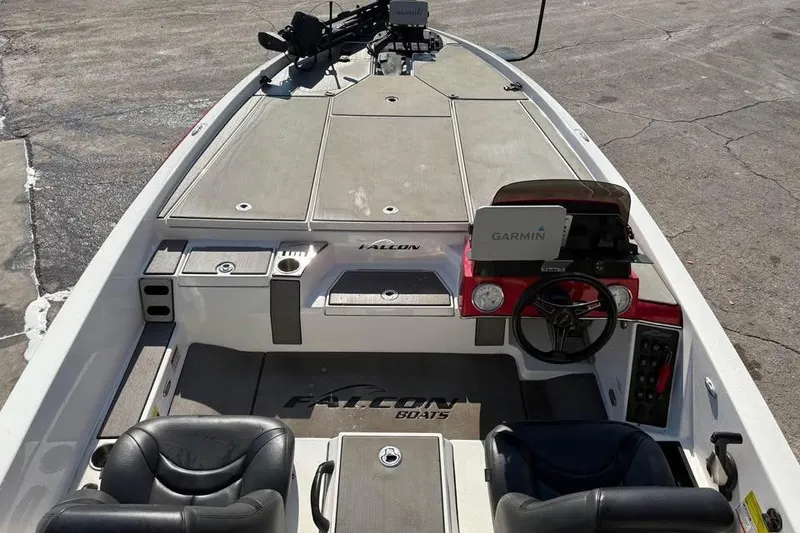Slide: The Image of 2021 Falcon Boats F205 interior with Garmin navigation system and dual seating. - 8