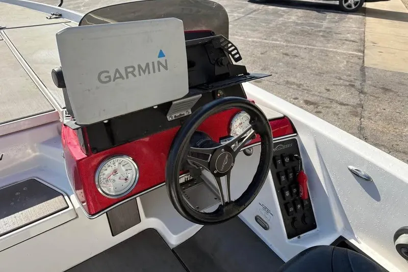 Slide: The Image of 2021 Falcon Boats F205 dashboard with Garmin GPS and steering wheel. - 9