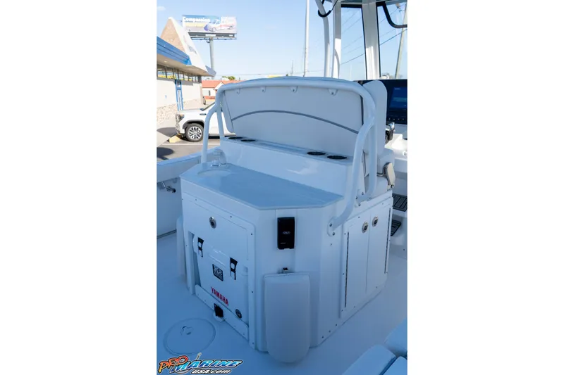 Slide: The Image of 2026 Sea Hunt Ultra 265 SE boat console with storage and cup holders. - 20