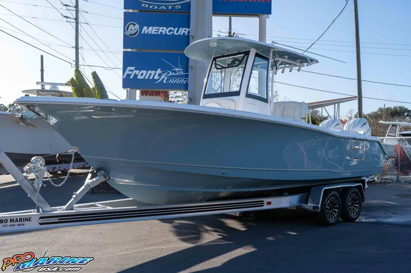 Slide: The Image of 2026 Sea Hunt Ultra 265 SE boat on trailer at dealership. - 26