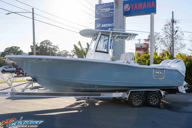 Slide: The Image of 2026 Sea Hunt Ultra 265 SE boat on trailer at dealership. - 27