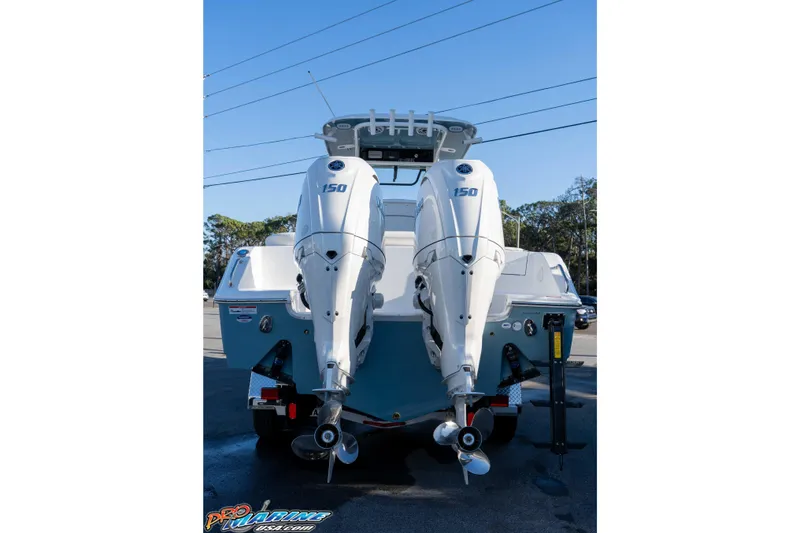 Slide: The Image of 2026 Sea Hunt Ultra 265 SE boat with dual 150 horsepower outboard engines. - 28