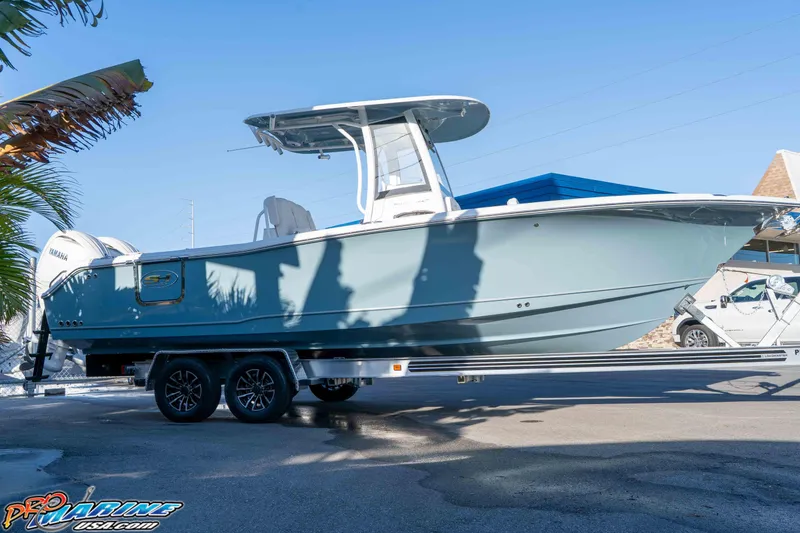 Slide: The Image of 2026 Sea Hunt Ultra 265 SE boat on trailer, side view, outdoors. - 6