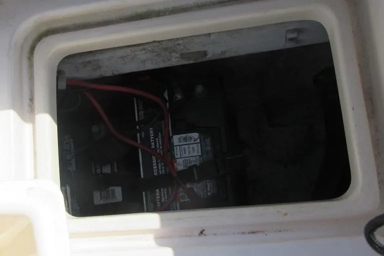 Slide: The Image of Battery compartment of 2004 Grady-White Seafarer 228 boat, showing wiring and connections. - 16