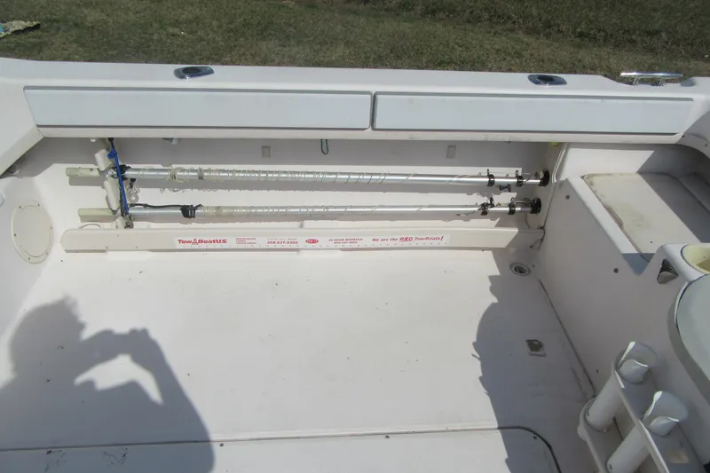 Slide: The Image of 2004 Grady-White Seafarer 228 boat interior with fishing rod holders. - 20