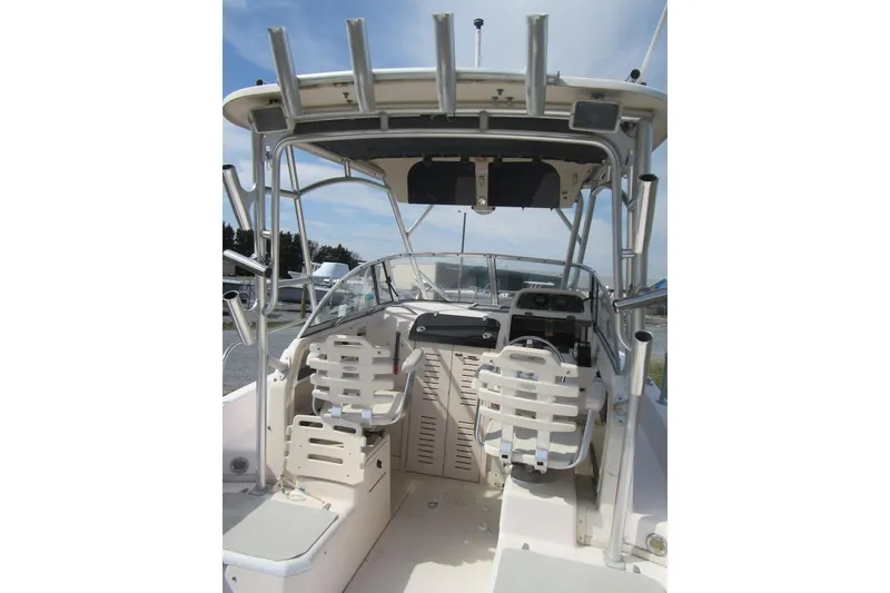 Slide: The Image of 2004 Grady-White Seafarer 228 boat interior with helm and seating. - 23