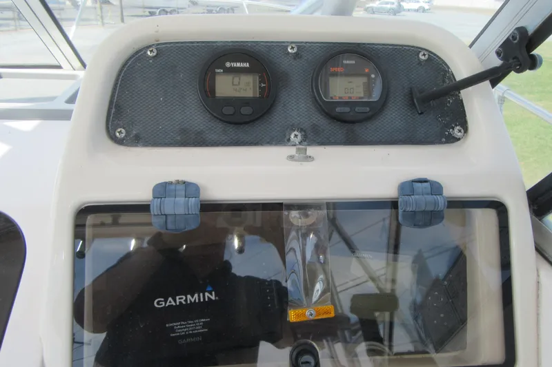 Slide: The Image of Dashboard of 2004 Grady-White Seafarer 228 with Yamaha gauges and Garmin display. - 31
