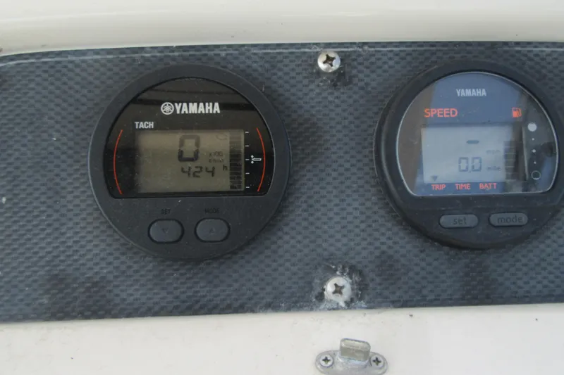 Slide: The Image of Yamaha tachometer and speedometer on 2004 Grady-White Seafarer 228 boat dashboard. - 34