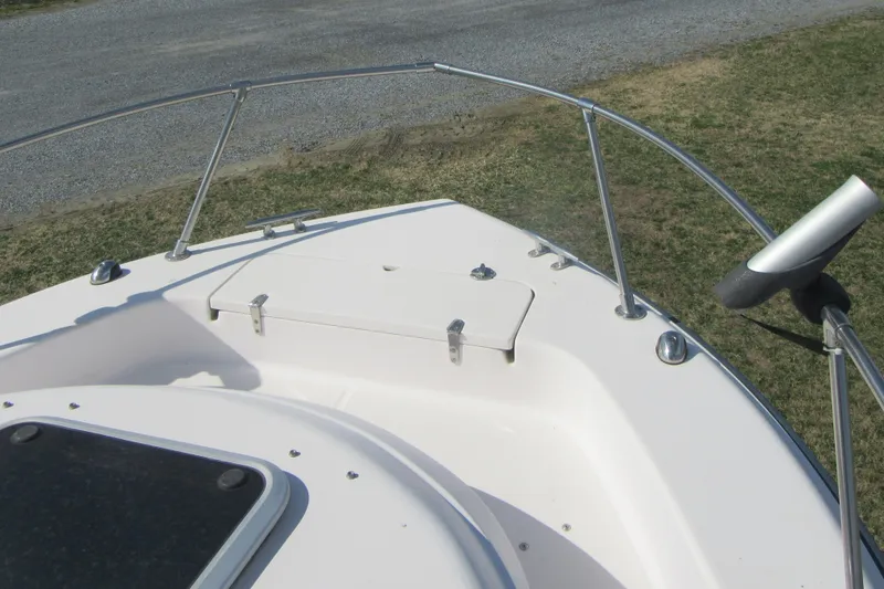 Slide: The Image of Bow of 2004 Grady-White Seafarer 228 boat with railing and hatch. - 39