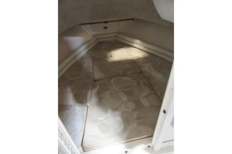 Slide: The Image of 2004 Grady-White Seafarer 228 cabin interior with cushioned seating area. - 40