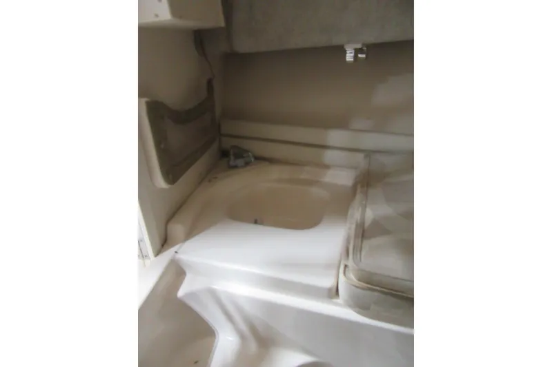 Slide: The Image of Interior cabin of 2004 Grady-White Seafarer 228 boat, featuring compact amenities. - 42