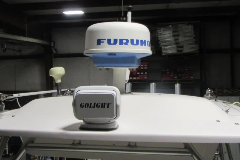 Slide: The Image of 2004 Grady-White Seafarer 228 with Furuno radar and Golight spotlight in a garage. - 45