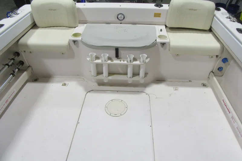 Slide: The Image of 2004 Grady-White Seafarer 228 boat interior with seating and rod holders. - 48