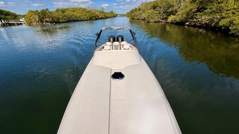 Slide: The Image of Pronautica 33 Sport 2014 on a calm river with lush green banks. - 18