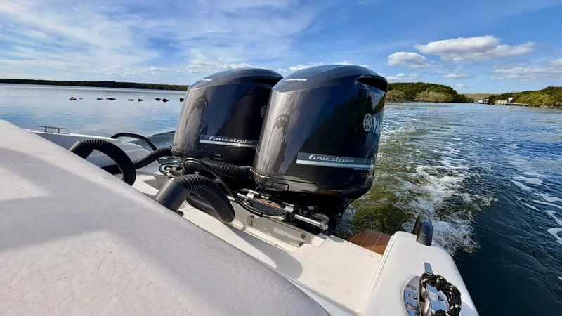 Slide: The Image of Pronautica 33 Sport 2014 with Yamaha engines on calm water. - 19