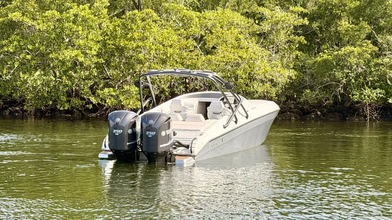 Slide: The Image of Pronautica 33 Sport 2014 boat in calm water near trees. - 2