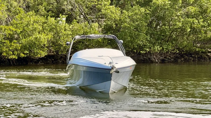 Slide: The Image of Pronautica 33 Sport 2014 boat on calm water near trees. - 3