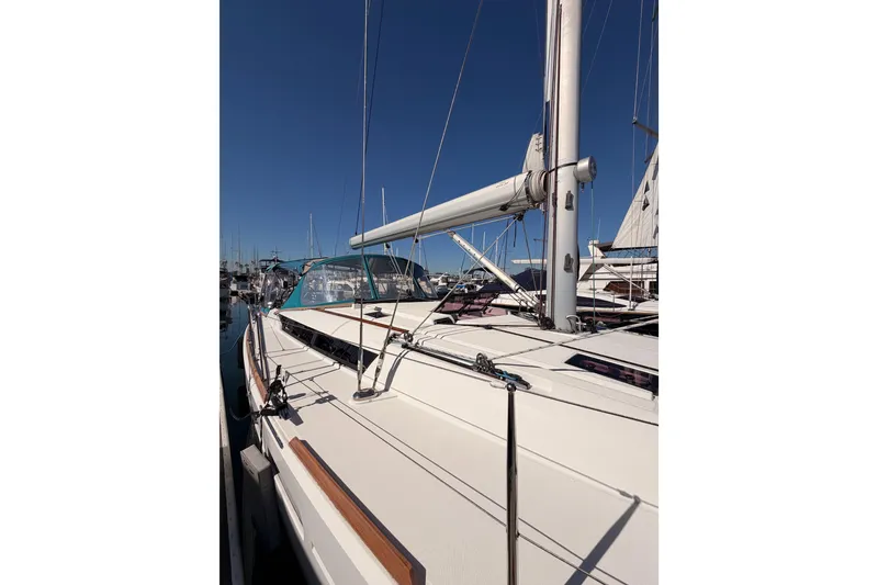 Slide: The Image of 2014 Jeanneau Sun Odyssey 469 sailboat docked under clear blue sky. - 10