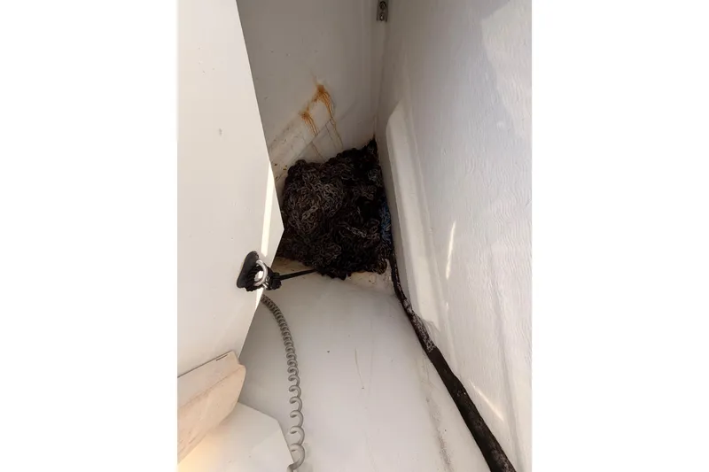 Slide: The Image of Anchor locker of 2014 Jeanneau Sun Odyssey 469 sailboat with coiled rope. - 20